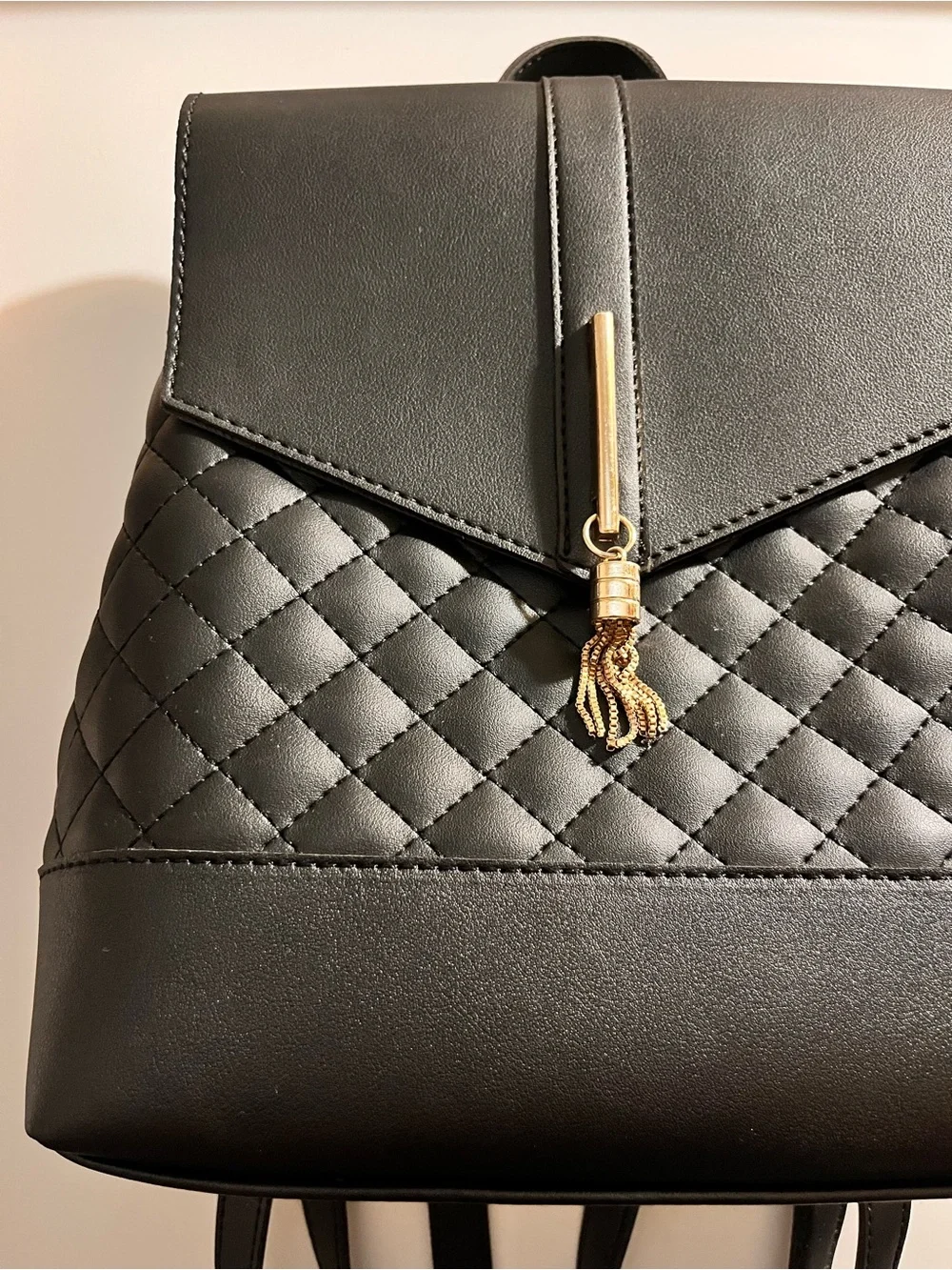 Black Quilted Backpack with Gold Charm